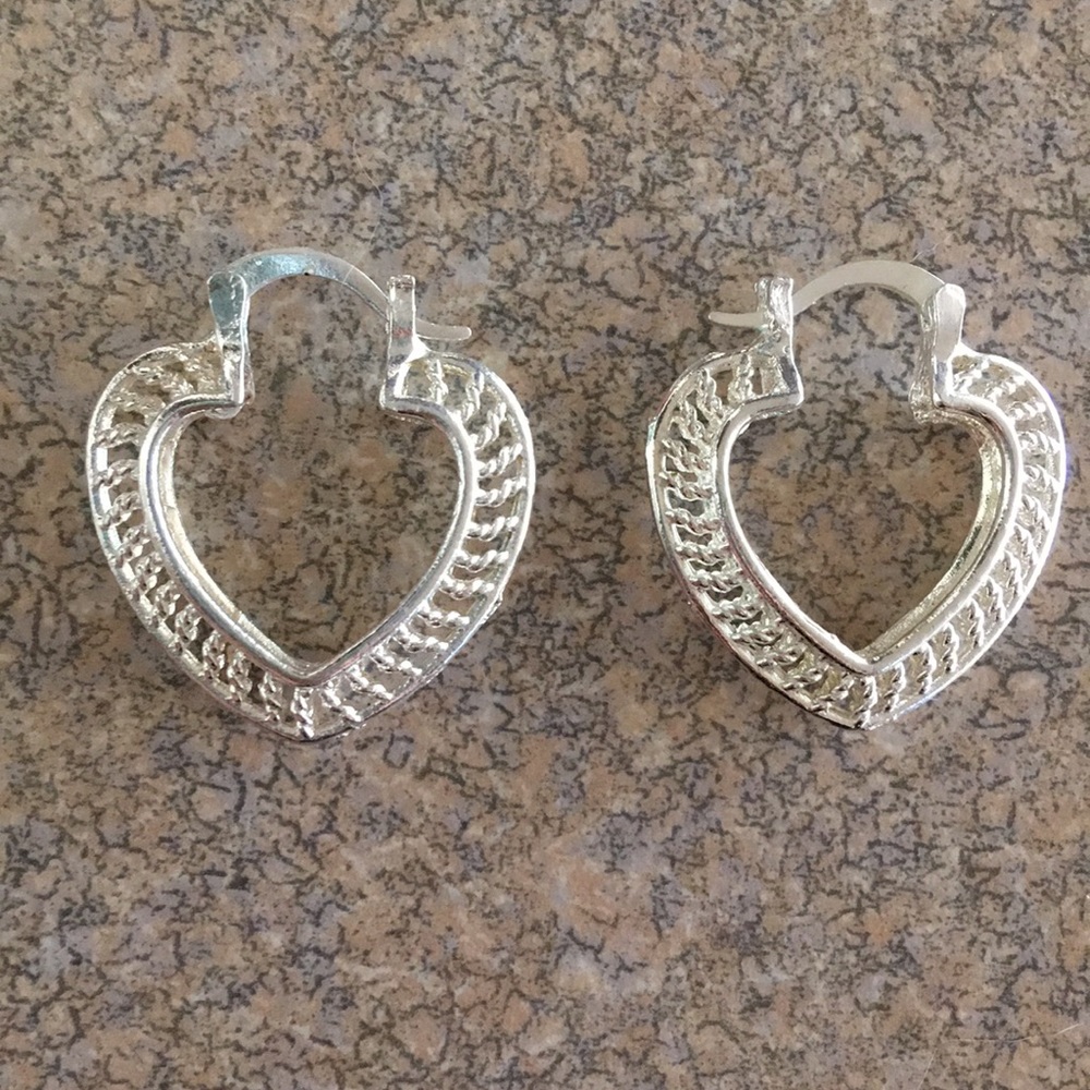 Chrome heart-shaped earrings.